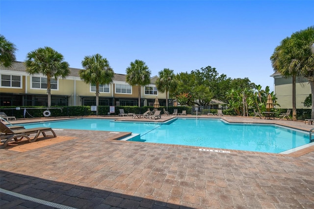 community pool featuring a patio area