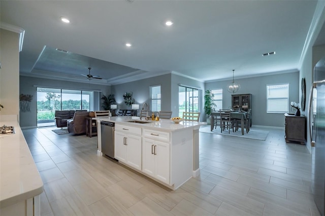 kitchen with a raised ceiling, appliances with stainless steel finishes, visible vents, and a healthy amount of sunlight