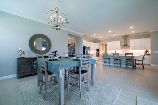 dining space with baseboards, recessed lighting, a notable chandelier, and crown molding