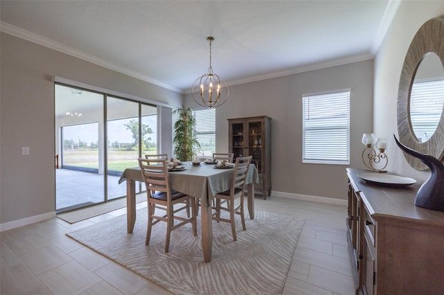 dining area featuring plenty of natural light, crown molding, and a notable chandelier