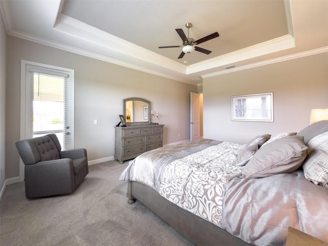 bedroom featuring ornamental molding, light carpet, visible vents, and a raised ceiling