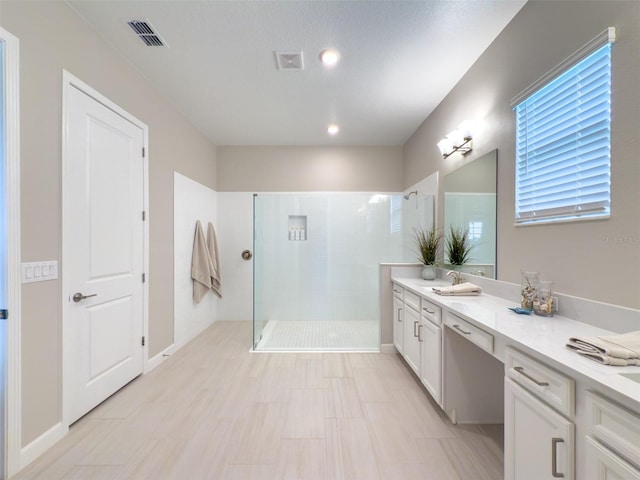full bathroom featuring visible vents, recessed lighting, vanity, and a walk in shower