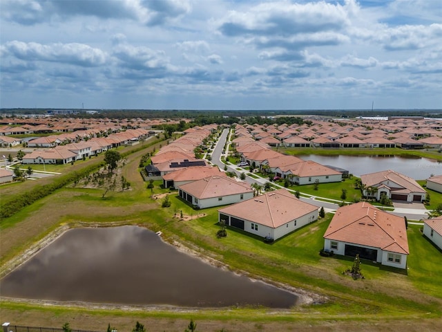 aerial view with a residential view and a water view