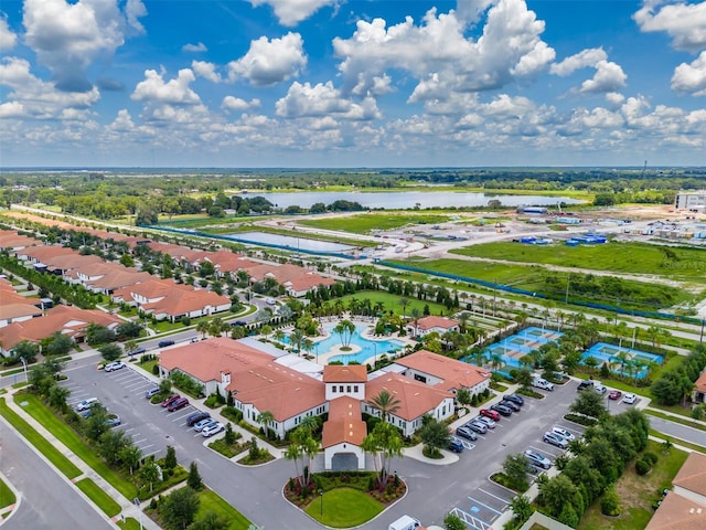 birds eye view of property with a water view