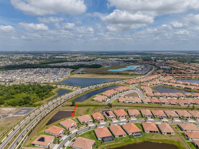 bird's eye view featuring a residential view and a water view
