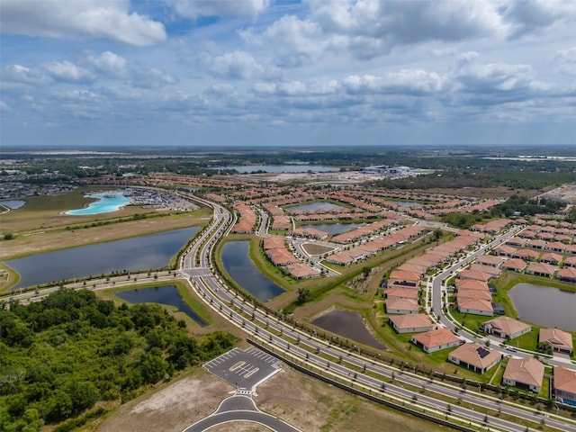 bird's eye view featuring a residential view and a water view