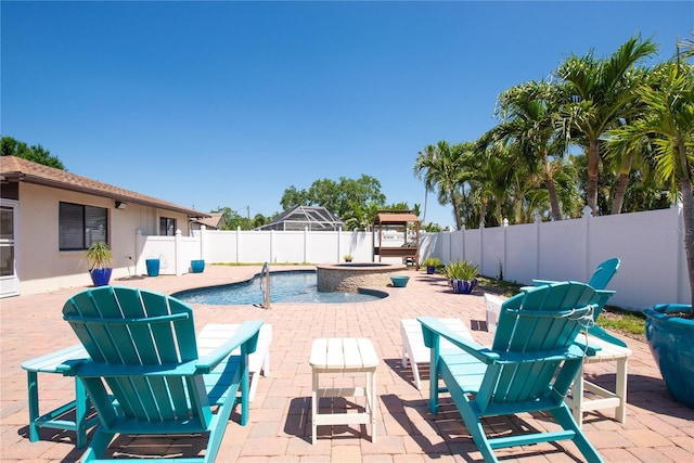 view of patio / terrace featuring a fenced backyard and a fenced in pool