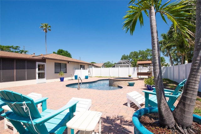 view of swimming pool featuring a fenced backyard, a patio, a fenced in pool, and an in ground hot tub