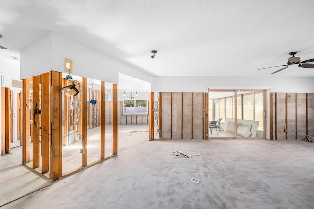 interior space with ceiling fan