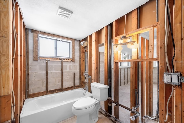 full bath featuring visible vents and toilet