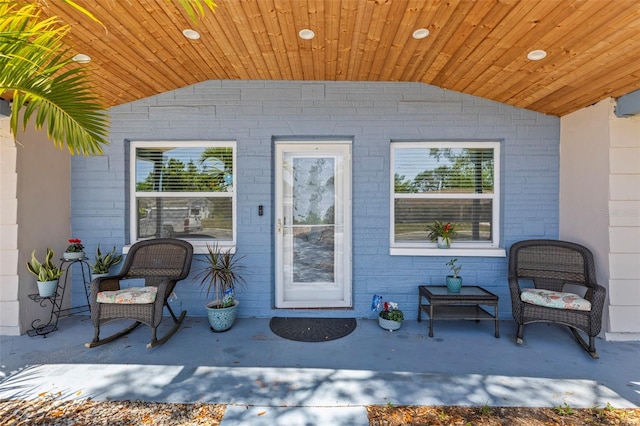1344 Dartmouth Dr, Holiday, FL 34691 - doorway to property featuring brick siding and a patio area