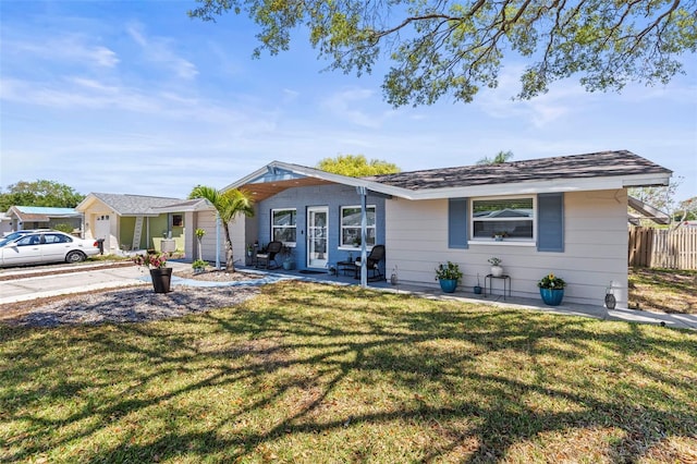 1344 Dartmouth Dr, Holiday, FL 34691 - ranch-style house featuring a garage, a front yard, and fence
