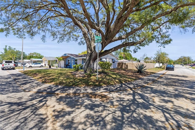 1344 Dartmouth Dr, Holiday, FL 34691 - view of home's exterior featuring fence