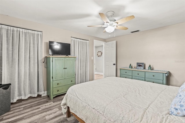 1344 Dartmouth Dr, Holiday, FL 34691 - bedroom featuring wood finished floors, visible vents, and ceiling fan