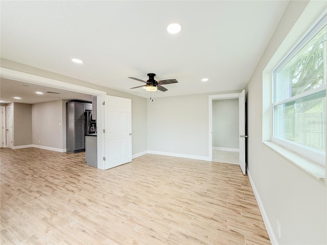 8648 78th Pl, Seminole, FL 33777 - unfurnished room with light wood-style flooring, baseboards, ceiling fan, and recessed lighting