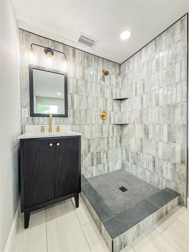 8648 78th Pl, Seminole, FL 33777 - full bath featuring a textured ceiling, tiled shower, and vanity