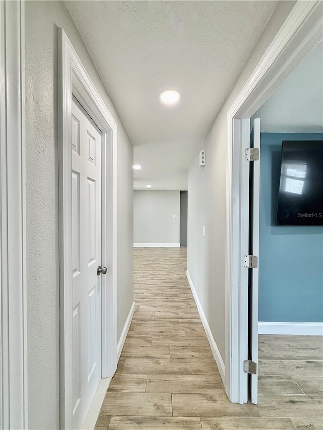 8648 78th Pl, Seminole, FL 33777 - corridor with wood finished floors, baseboards, and recessed lighting