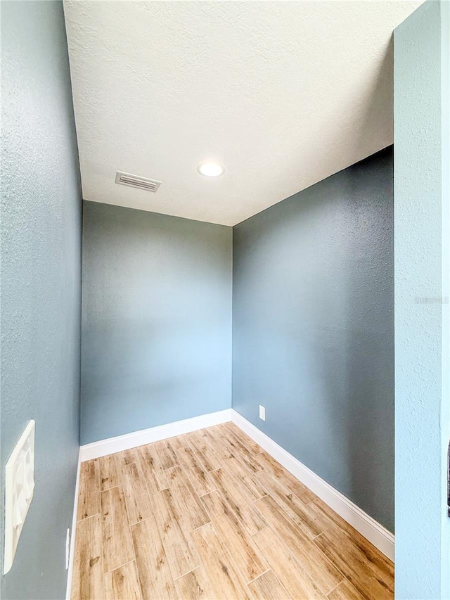 8648 78th Pl, Seminole, FL 33777 - unfurnished room featuring wood finished floors, baseboards, and recessed lighting