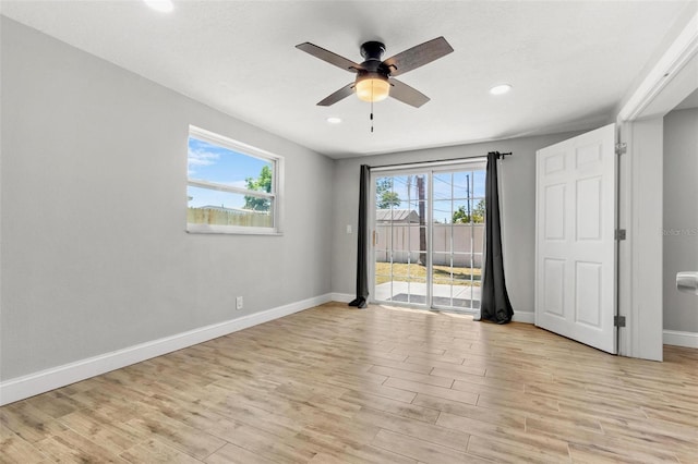 8648 78th Pl, Seminole, FL 33777 - unfurnished bedroom featuring access to exterior, baseboards, light wood-style flooring, recessed lighting, and a ceiling fan