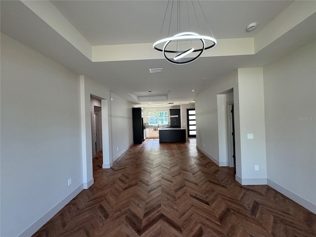 7208 N Glen Ave, Tampa, FL 33614 - hall featuring attic access, baseboards, a tray ceiling, and visible vents