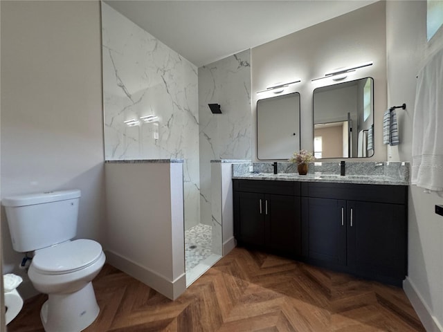 7208 N Glen Ave, Tampa, FL 33614 - full bathroom featuring toilet, a sink, a marble finish shower, double vanity, and baseboards