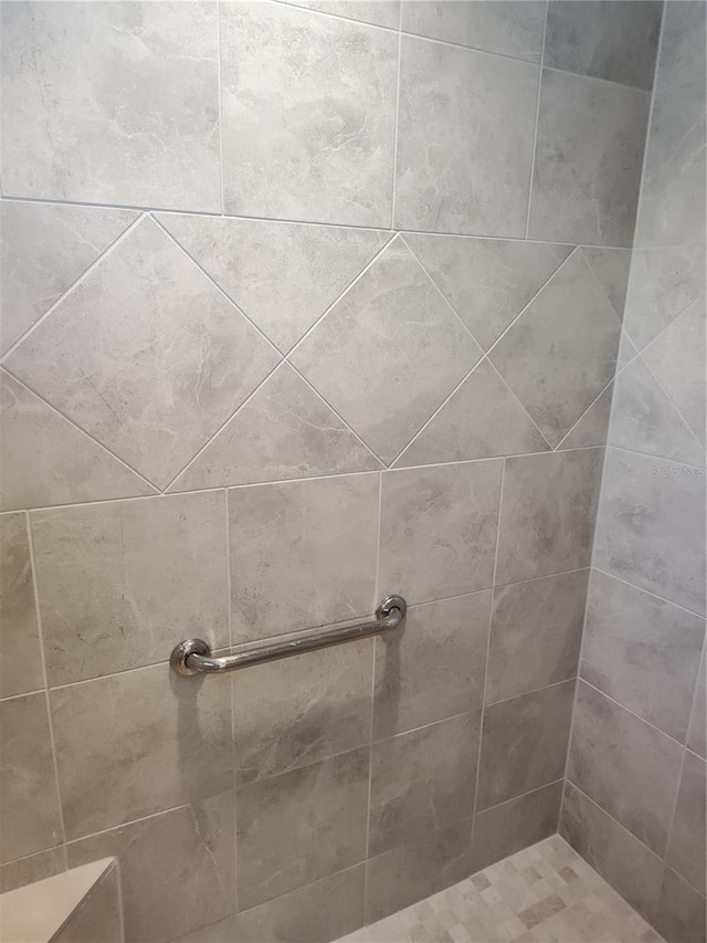 bathroom with tiled shower