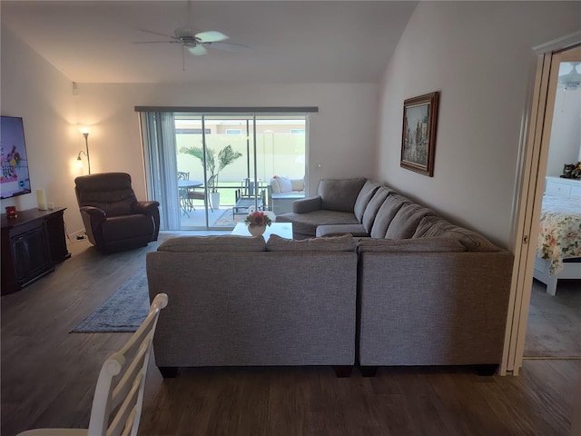 6030 Dijulio Ter, The Villages, FL 32163 - living area with dark wood finished floors, ceiling fan, and vaulted ceiling