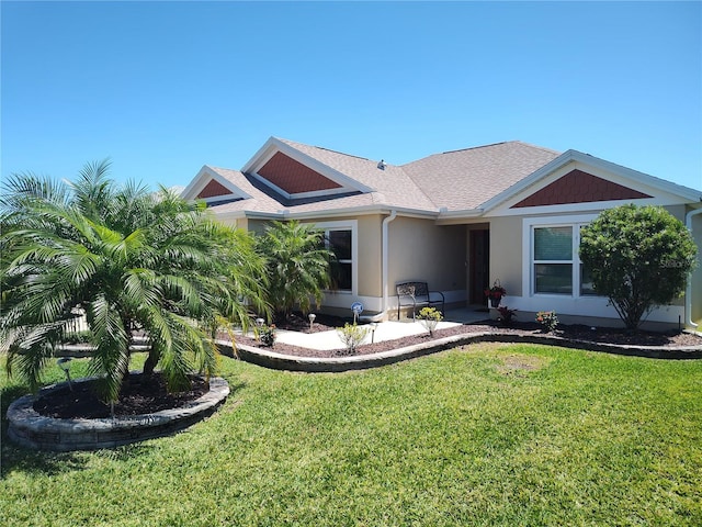 6030 Dijulio Ter, The Villages, FL 32163 - view of front facade with stucco siding, a shingled roof, and a front lawn
