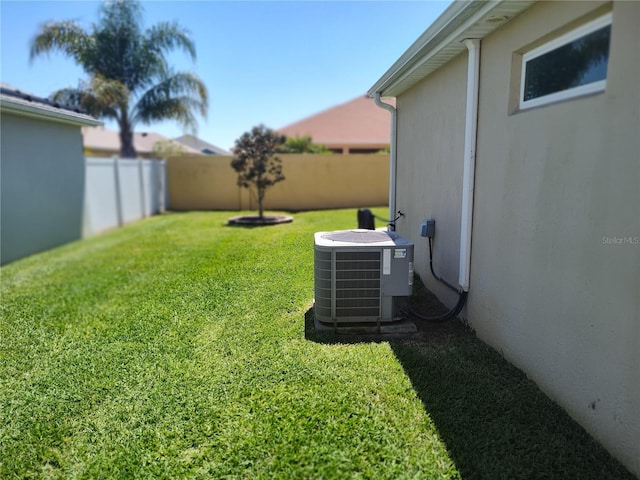 6030 Dijulio Ter, The Villages, FL 32163 - view of yard featuring central AC unit and a fenced backyard