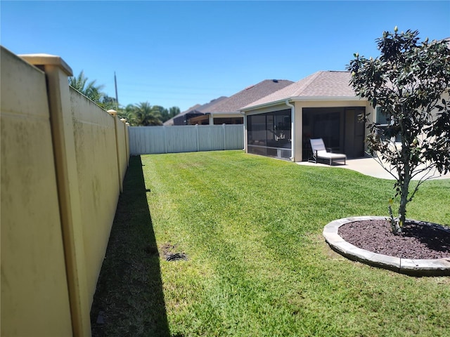 6030 Dijulio Ter, The Villages, FL 32163 - view of yard with a sunroom and a fenced backyard