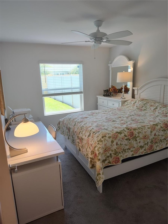 6030 Dijulio Ter, The Villages, FL 32163 - bedroom featuring a ceiling fan and dark carpet