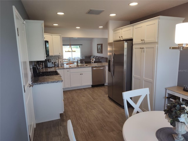 6030 Dijulio Ter, The Villages, FL 32163 - kitchen with white cabinetry, appliances with stainless steel finishes, visible vents, and a sink