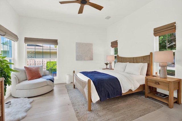 420 48th St N, Saint Petersburg, FL 33713 - bedroom with wood finished floors, visible vents, ceiling fan, and multiple windows