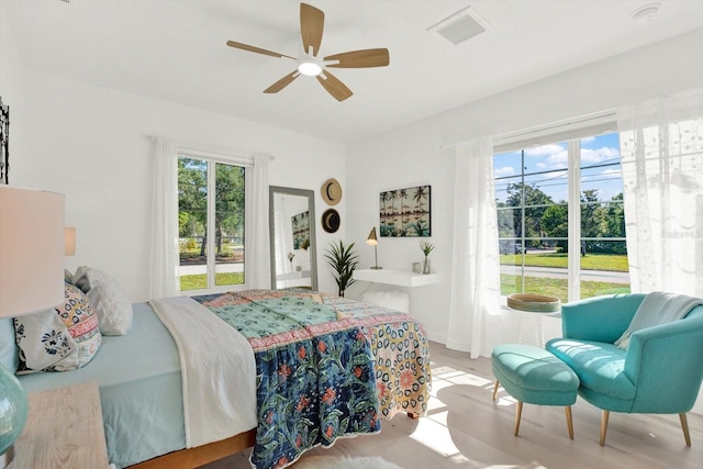 420 48th St N, Saint Petersburg, FL 33713 - bedroom featuring a ceiling fan, wood finished floors, and visible vents