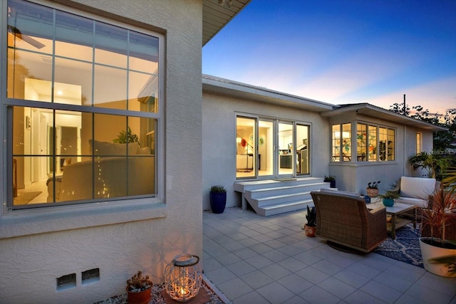 420 48th St N, Saint Petersburg, FL 33713 - back of house with a patio area, outdoor lounge area, and stucco siding