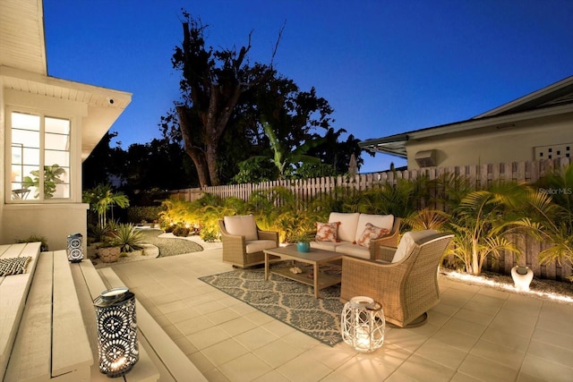 420 48th St N, Saint Petersburg, FL 33713 - patio at night featuring an outdoor living space and fence