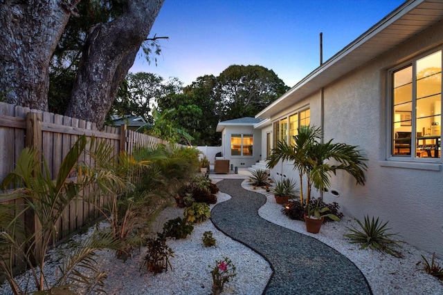 420 48th St N, Saint Petersburg, FL 33713 - yard at dusk featuring a fenced backyard and a patio