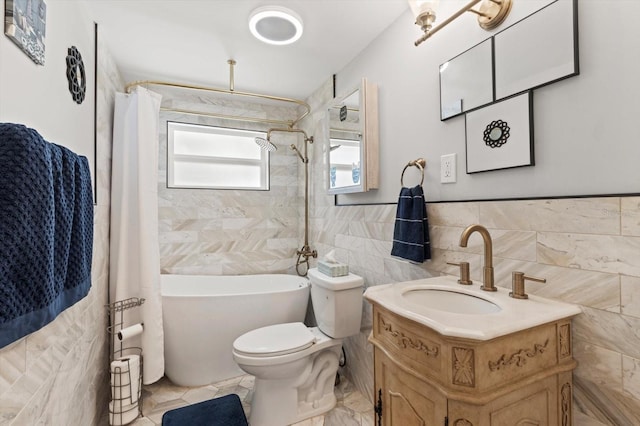 bathroom featuring toilet, tile walls, wainscoting, shower / bathtub combination with curtain, and vanity