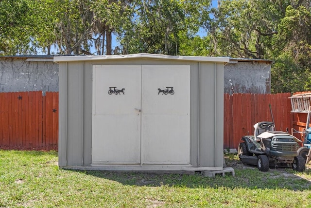 view of shed with fence
