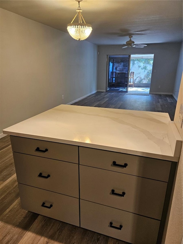 414 Danube Ave, Tampa, FL 33606 - kitchen with decorative light fixtures, gray cabinetry, open floor plan, and dark wood finished floors