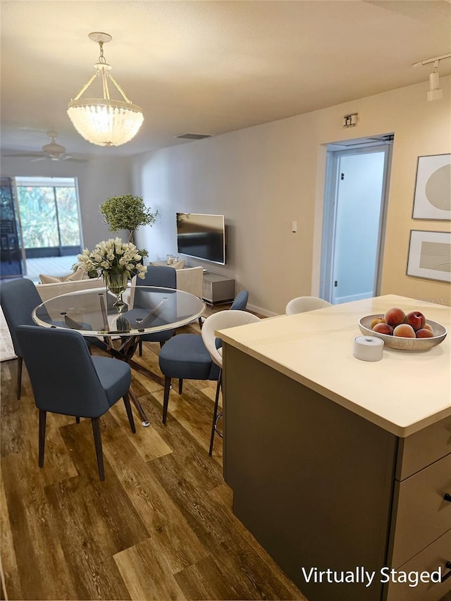 414 Danube Ave, Tampa, FL 33606 - dining space featuring dark wood-style floors and visible vents