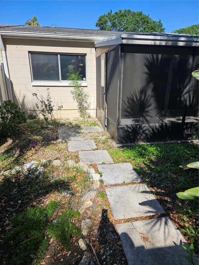 414 Danube Ave, Tampa, FL 33606 - exterior space featuring a sunroom and concrete block siding