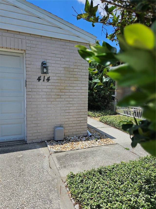 414 Danube Ave, Tampa, FL 33606 - view of exterior entry featuring brick siding and fence