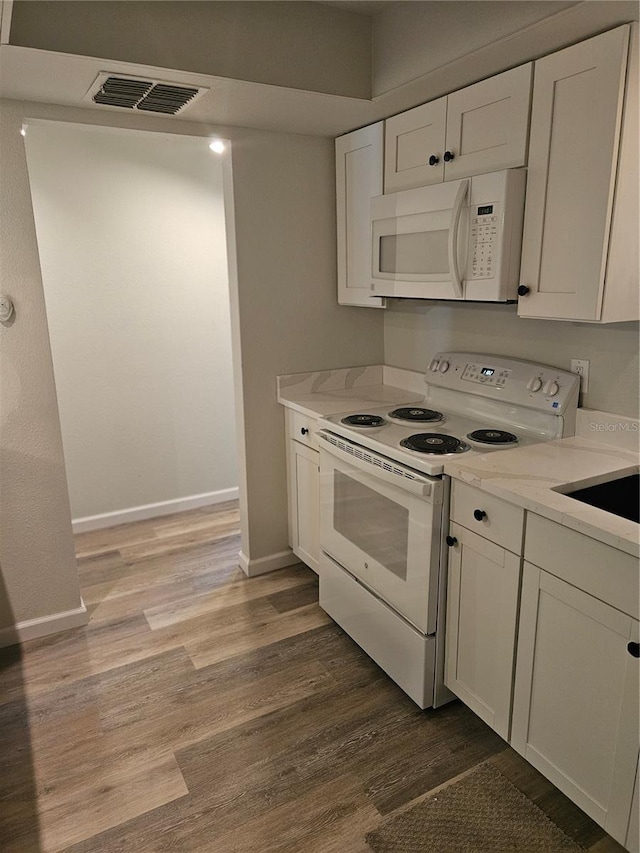 414 Danube Ave, Tampa, FL 33606 - kitchen featuring white cabinetry, white appliances, visible vents, and wood finished floors