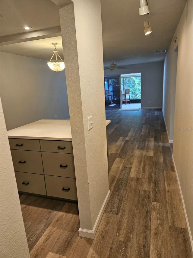 414 Danube Ave, Tampa, FL 33606 - hall featuring rail lighting, baseboards, dark wood-style floors, and visible vents