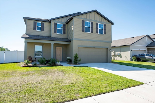 view of front of house with fence, an attached garage, board and batten siding, driveway, and a front yard