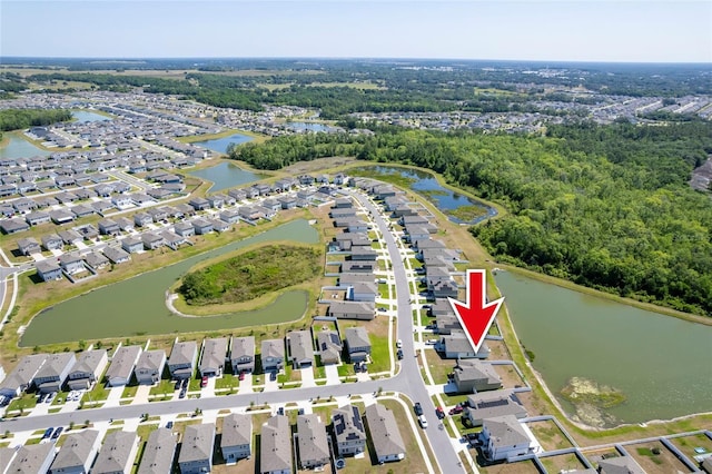 bird's eye view featuring a residential view and a water view