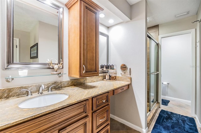 6821 Mary Lou Ln, Wesley Chapel, FL 33544 - bathroom featuring vanity, tile patterned floors, baseboards, and a stall shower
