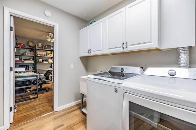 6821 Mary Lou Ln, Wesley Chapel, FL 33544 - laundry area with light wood-style floors, washer and clothes dryer, cabinet space, and a ceiling fan