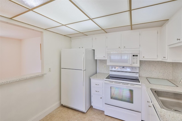 1802 Bedford Ter Unit 187, Sun City Center, FL 33573 - kitchen featuring white appliances, a sink, white cabinets, and light countertops